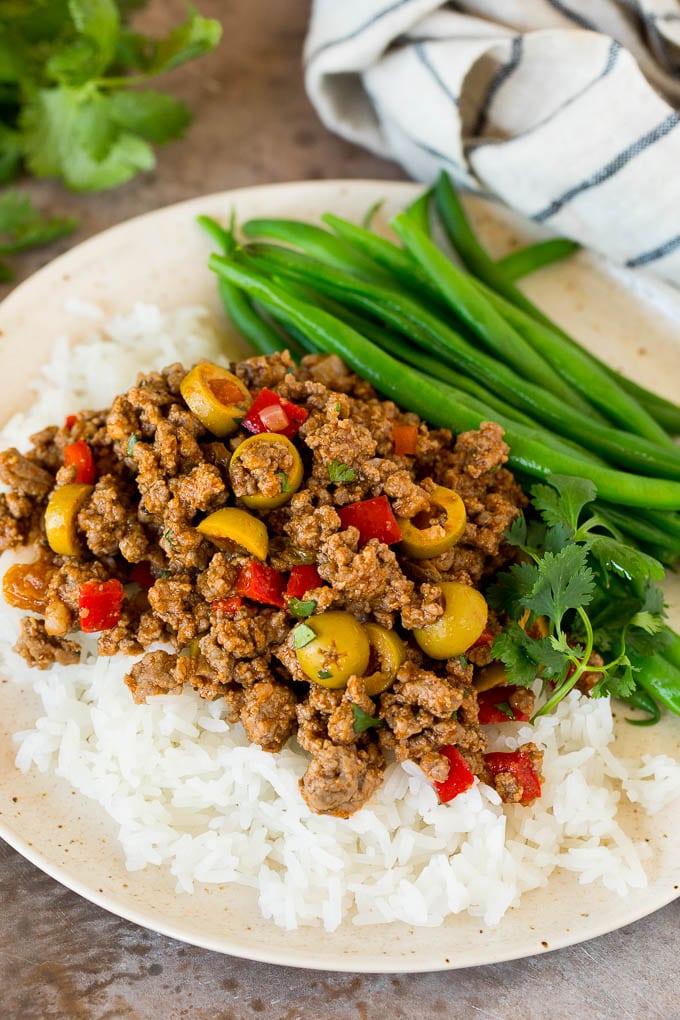 Picadillo served over rice with a side of green beans.