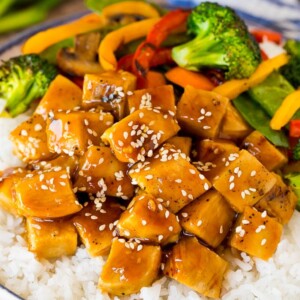 Teriyaki chicken bowl with vegetables served over rice.