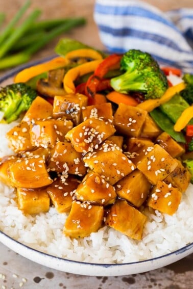 Teriyaki chicken bowl with vegetables served over rice.