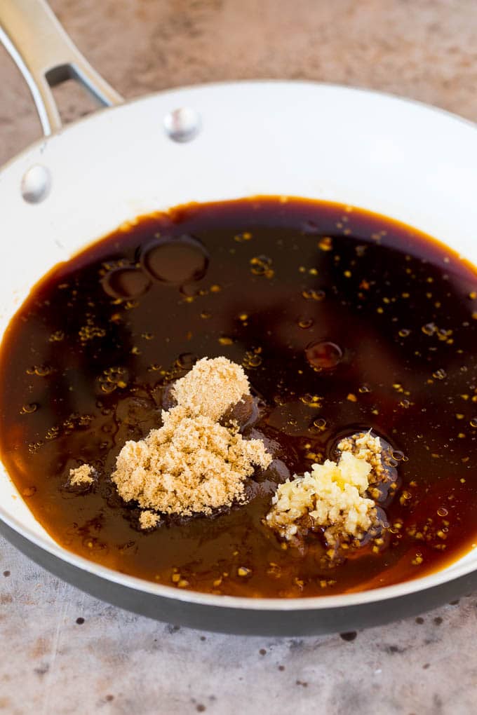 A pan of soy sauce, garlic, ginger, brown sugar and honey.