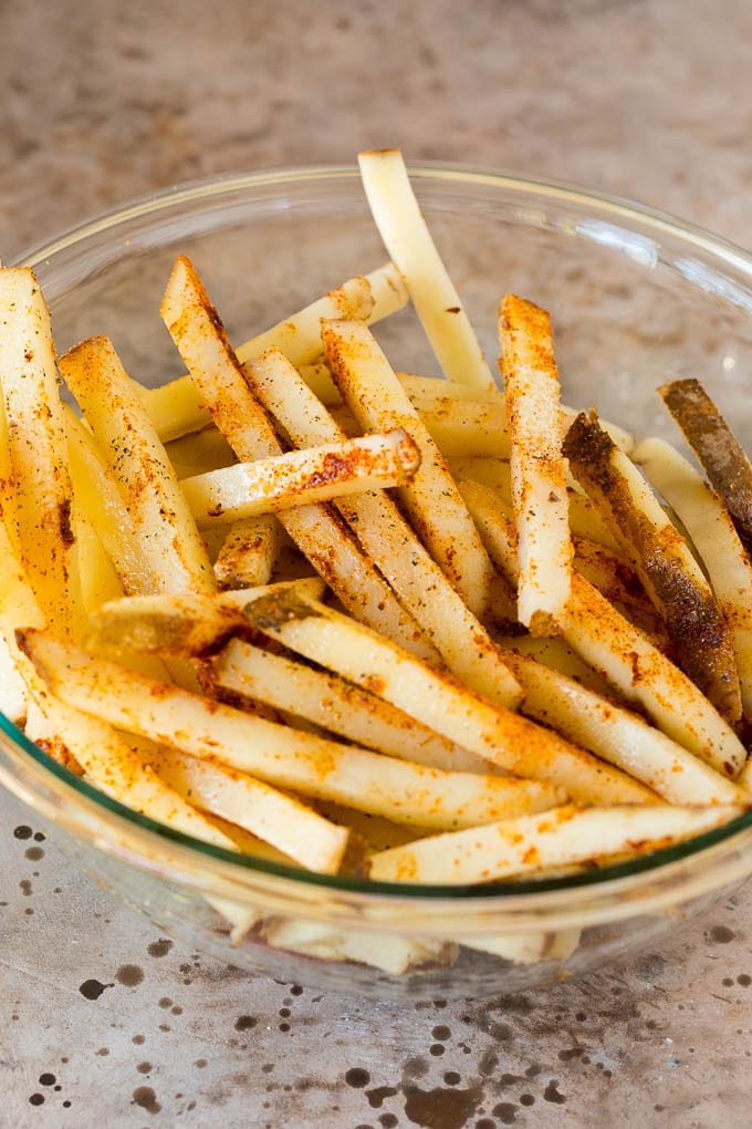 Potato sticks coated in spices and vegetable oil.