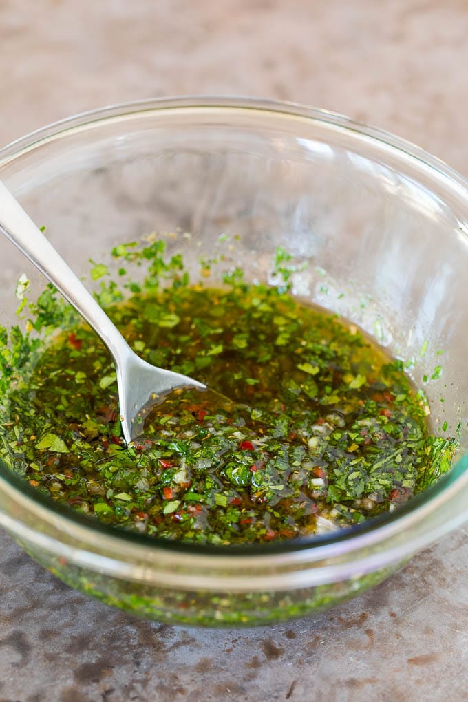 A bowl of homemade chimichurri sauce.