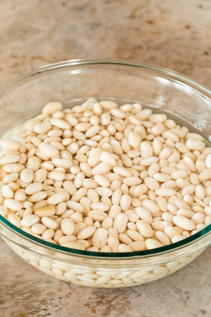 A bowl of beans in water.