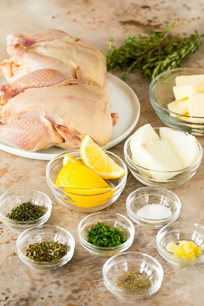 Bowls of ingredients including butter, herbs and lemon.