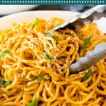 These sesame noodles are Asian noodles tossed in a savory peanut and sesame sauce, then garnished with sesame seeds and green onions.