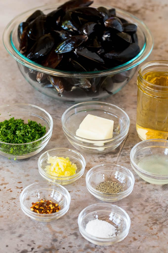 Bowls of mussels, butter, spices and herbs.