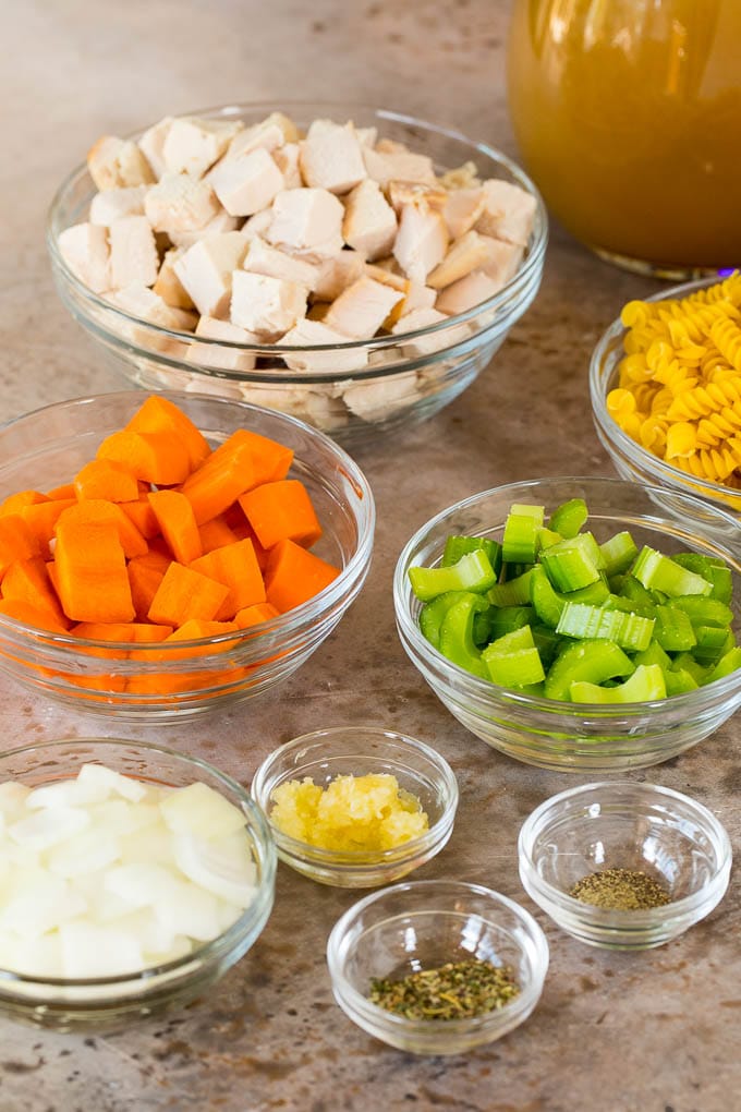 Bowls of vegetables, diced turkey and pasta.