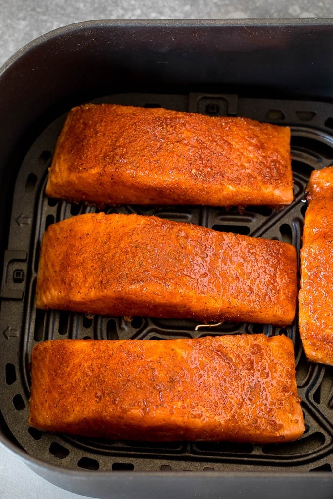 Spice crusted salmon fillets in an air fryer.