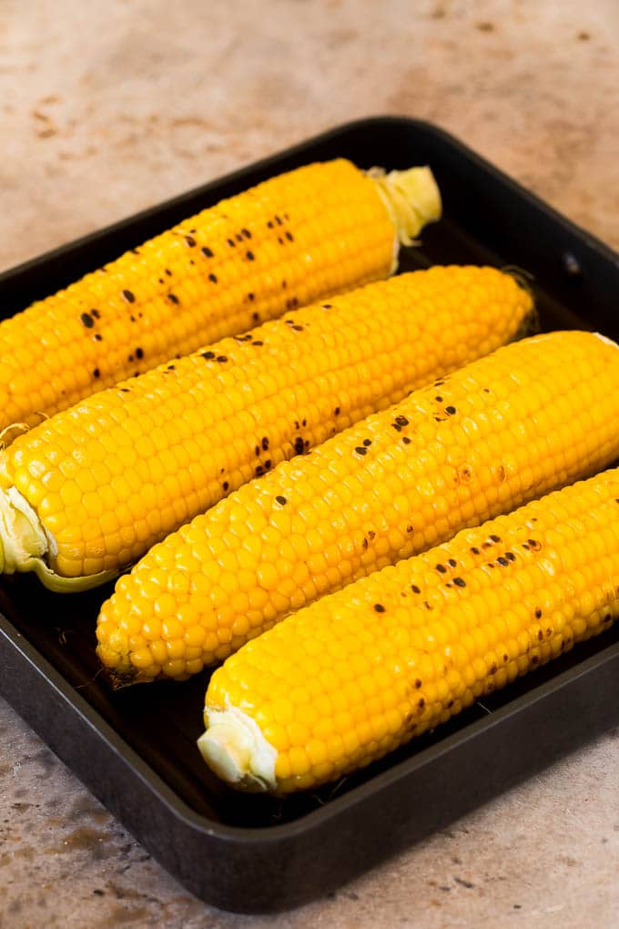 Cobs of corn on a grill pan.