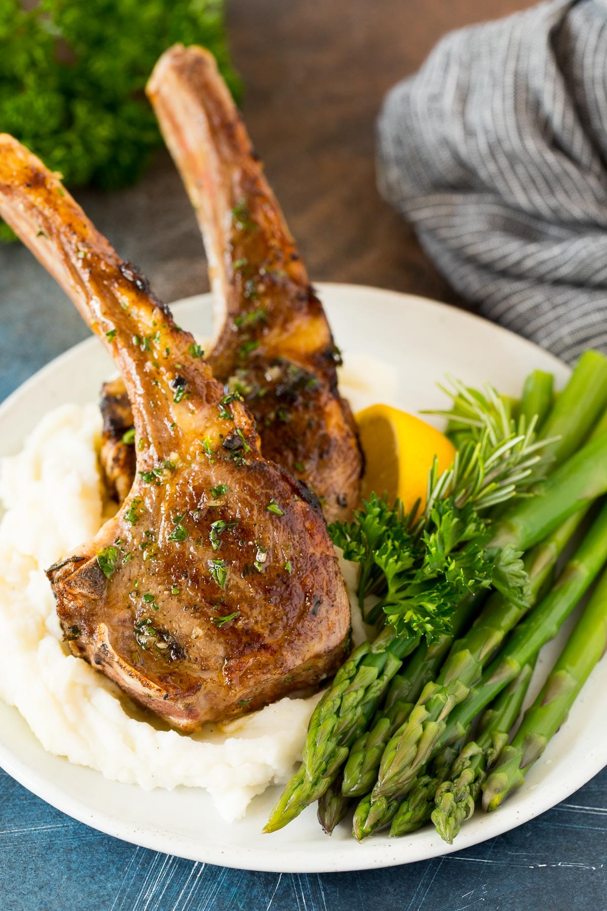 Grilled lamb chops served with mashed potatoes and asparagus.