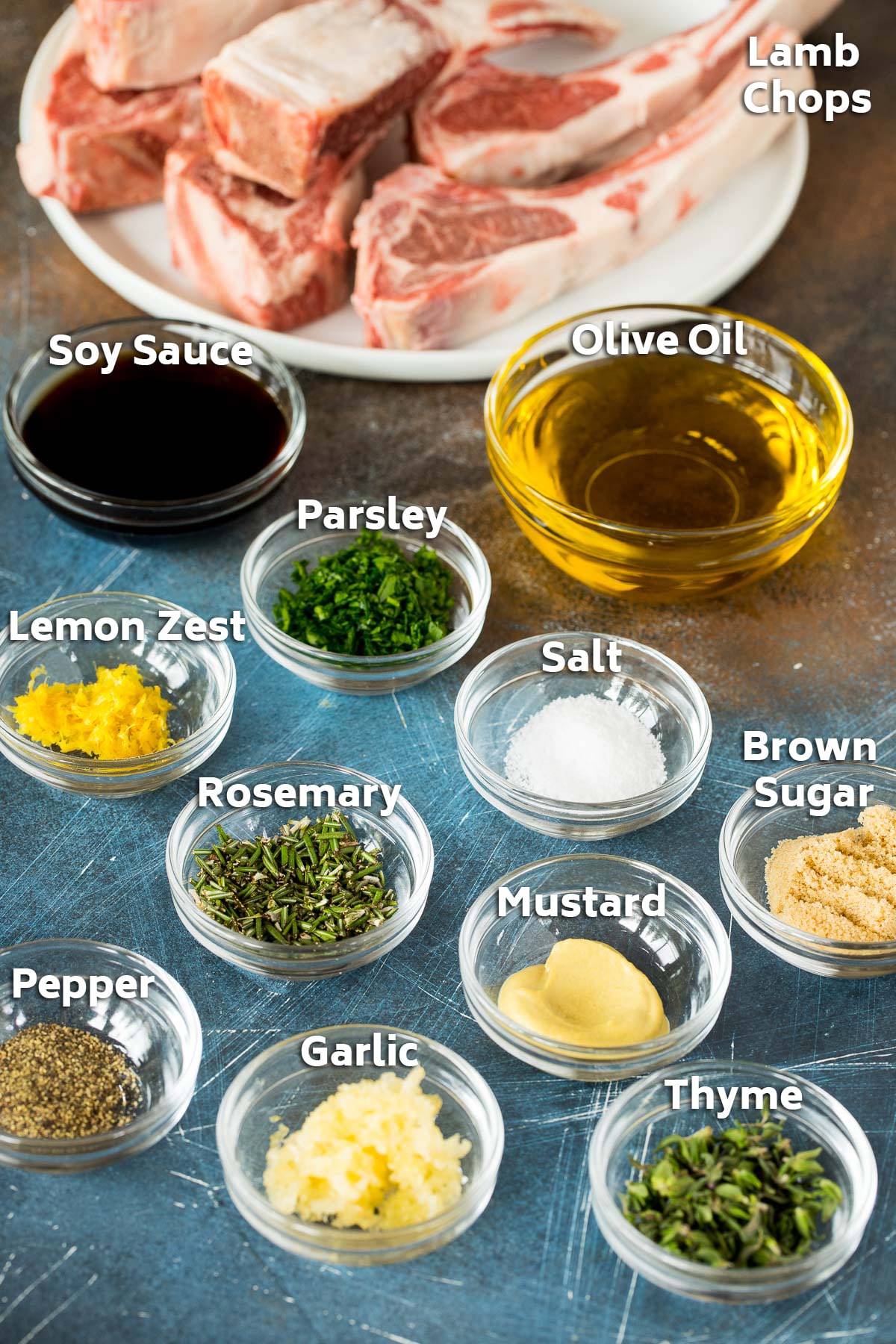 Bowls of ingredients including olive oil, garlic, herbs and spices.