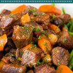This slow cooker beef bourguignon is tender beef chunks, bacon, mushrooms, carrots and pearl onions, all simmered together in a rich red wine broth.