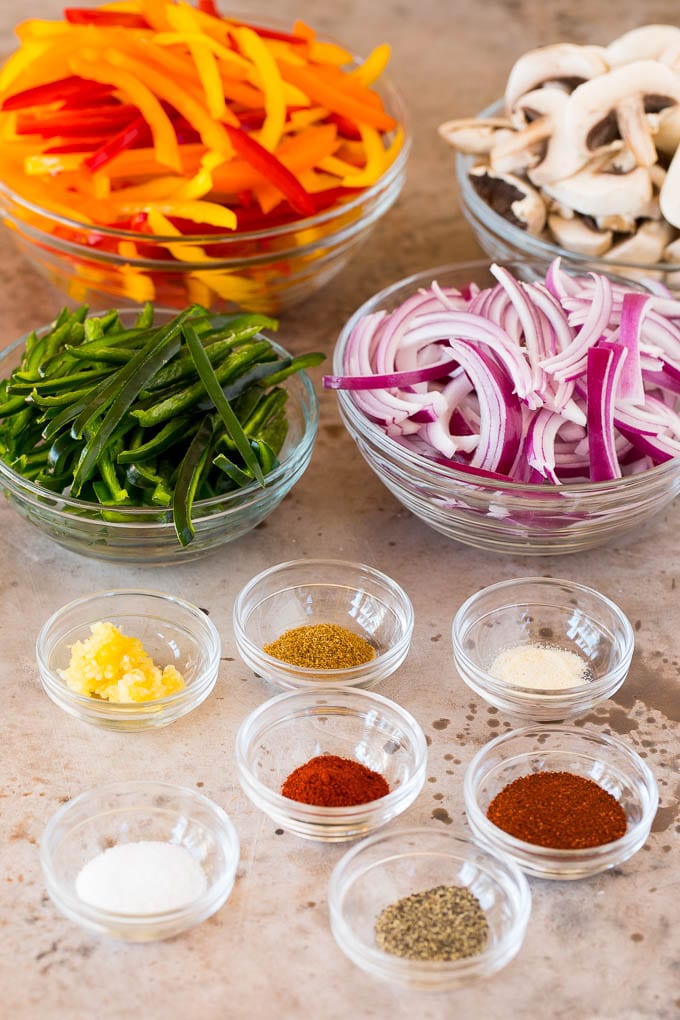 Bowls of spiced and sliced vegetables.