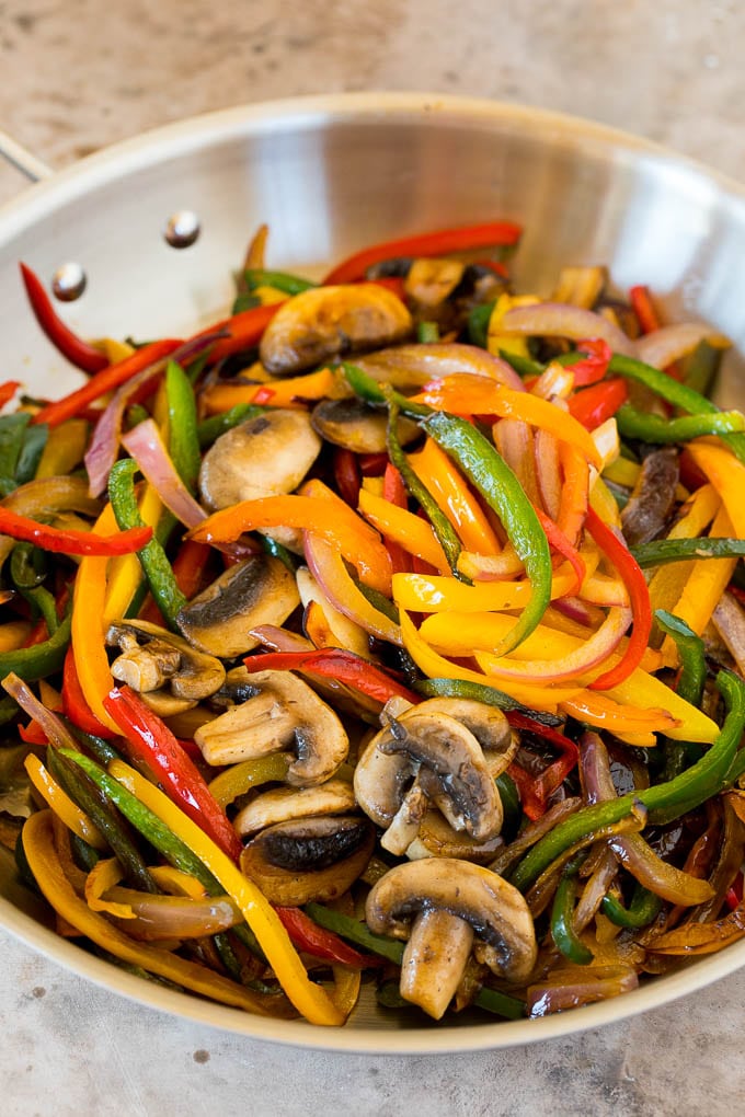 A pan of cooked peppers and mushrooms.