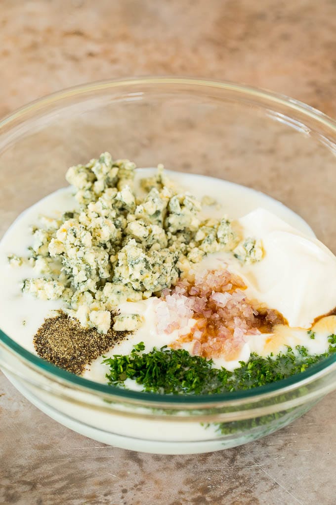 Ingredients in a bowl for blue cheese dressing.