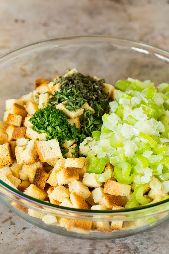 A bowl of diced bread, celery, onions, herbs and seasonings.