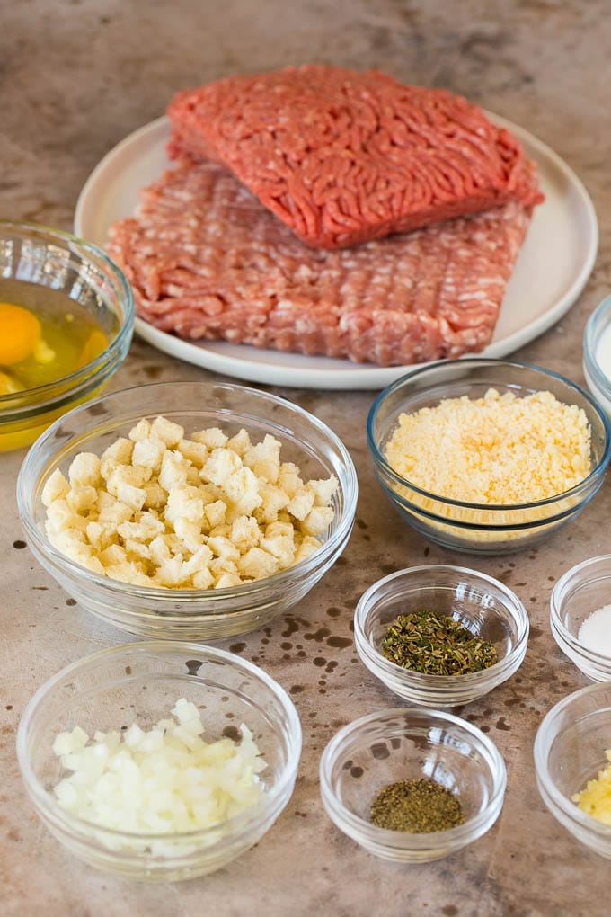 Bowls of ingredients to make meatballs.