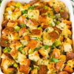 Thanksgiving stuffing in a baking dish, topped with parsley.