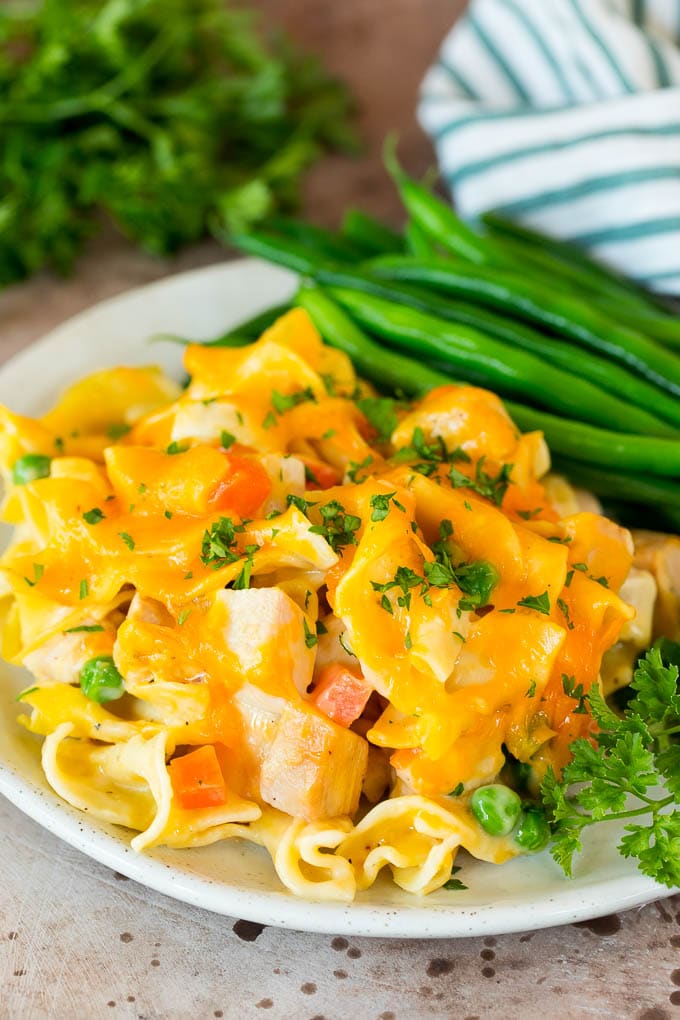 Turkey casserole served on a plate with green beans.