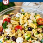 This chicken pasta salad is grilled chicken with olives, cheese and fresh vegetables, all tossed in a homemade Italian dressing.