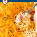This chicken spaghetti is a baked pasta dish with diced chicken and zesty tomatoes in a creamy cheese sauce.