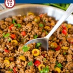This picadillo is a blend of ground beef, olives and vegetables, all simmered together with spices and tomato sauce.