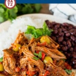 This ropa vieja recipe is a traditional dish of beef roast that's simmered with tomatoes and seasonings until tender, then shredded and served with olives.