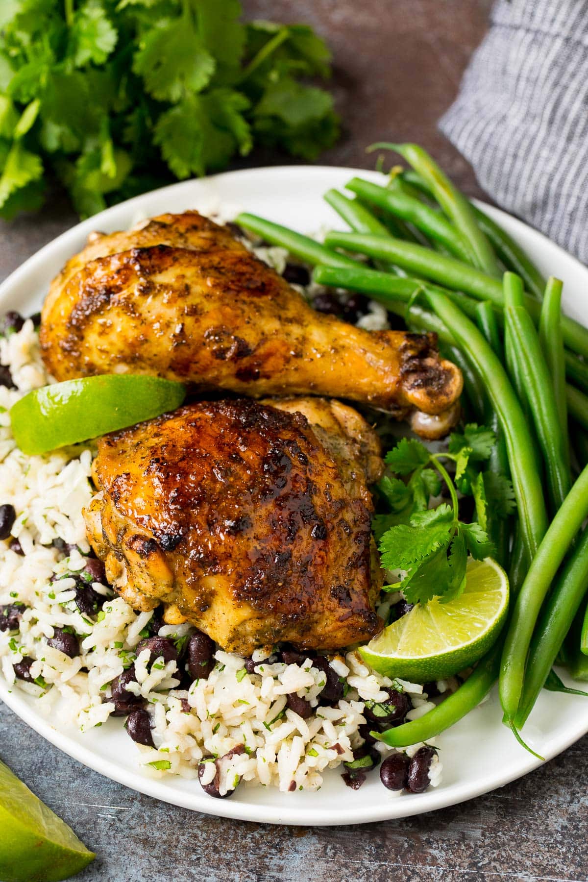 Chicken coated with Jamaican jerk seasoning, served with rice and beans.