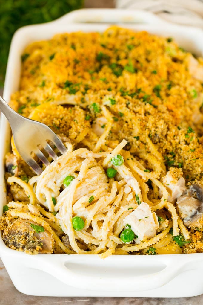 A fork serving up a portion of turkey tetrazzini.