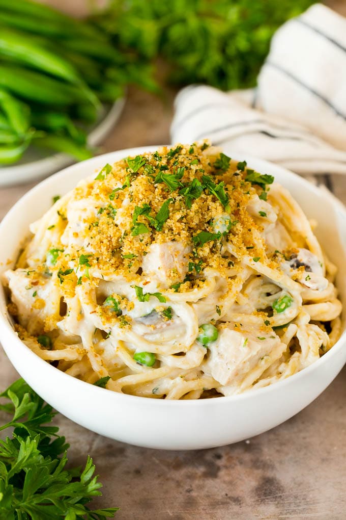 A bowl of turkey tetrazzini topped with breadcrumbs.