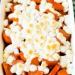 A pan of candied yams topped with marshmallows.