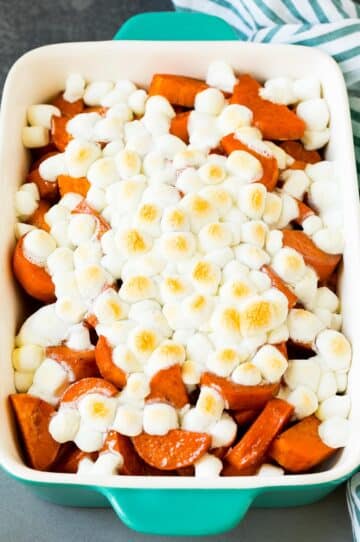A pan of candied yams topped with marshmallows.