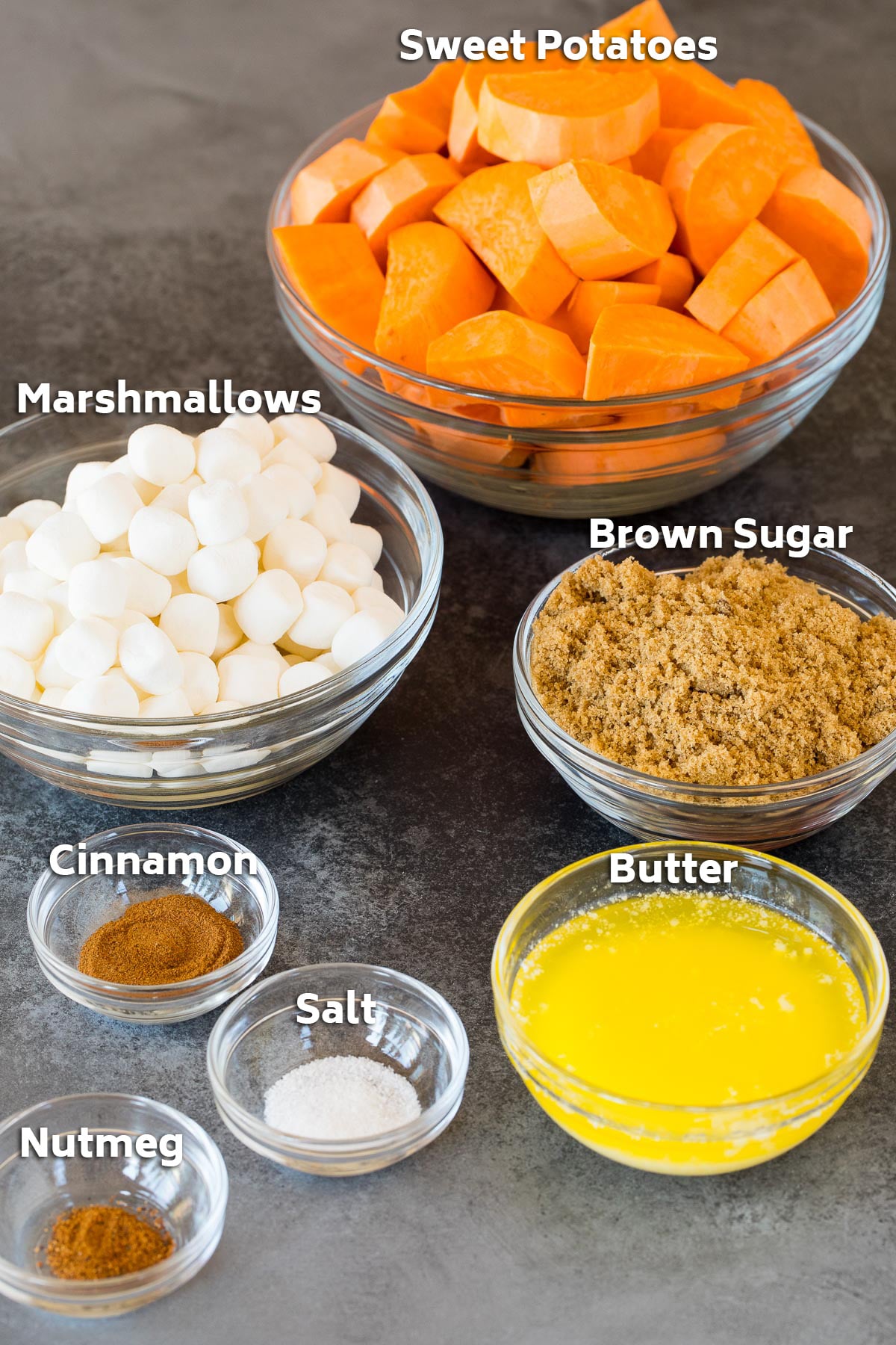 Bowls of ingredients including sweet potatoes, sugar, butter and spices.