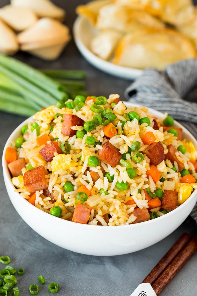 A bowl of Spam fried rice topped with green onions.