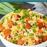 This Spam fried rice is made with seared Spam, eggs, vegetables and rice, all cooked together with seasonings to make a quick and easy meal.