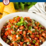 This salsa fresca is a blend of diced ripe tomatoes, onion, jalapeno, cilantro and lime juice, all mixed together to make a light and refreshing dip or condiment.