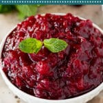 This slow cooker cranberry sauce is fresh cranberries, orange, cinnamon and vanilla cooked together in a crock pot to make a bright and flavorful condiment.