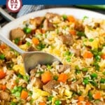 This pork fried rice is pork tenderloin pieces cooked with vegetables, eggs and rice in a savory sauce.