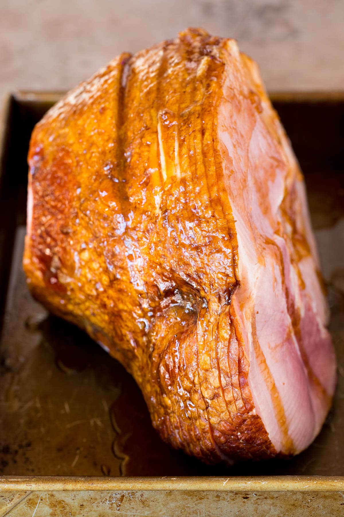 A ham coated in brown sugar glaze.