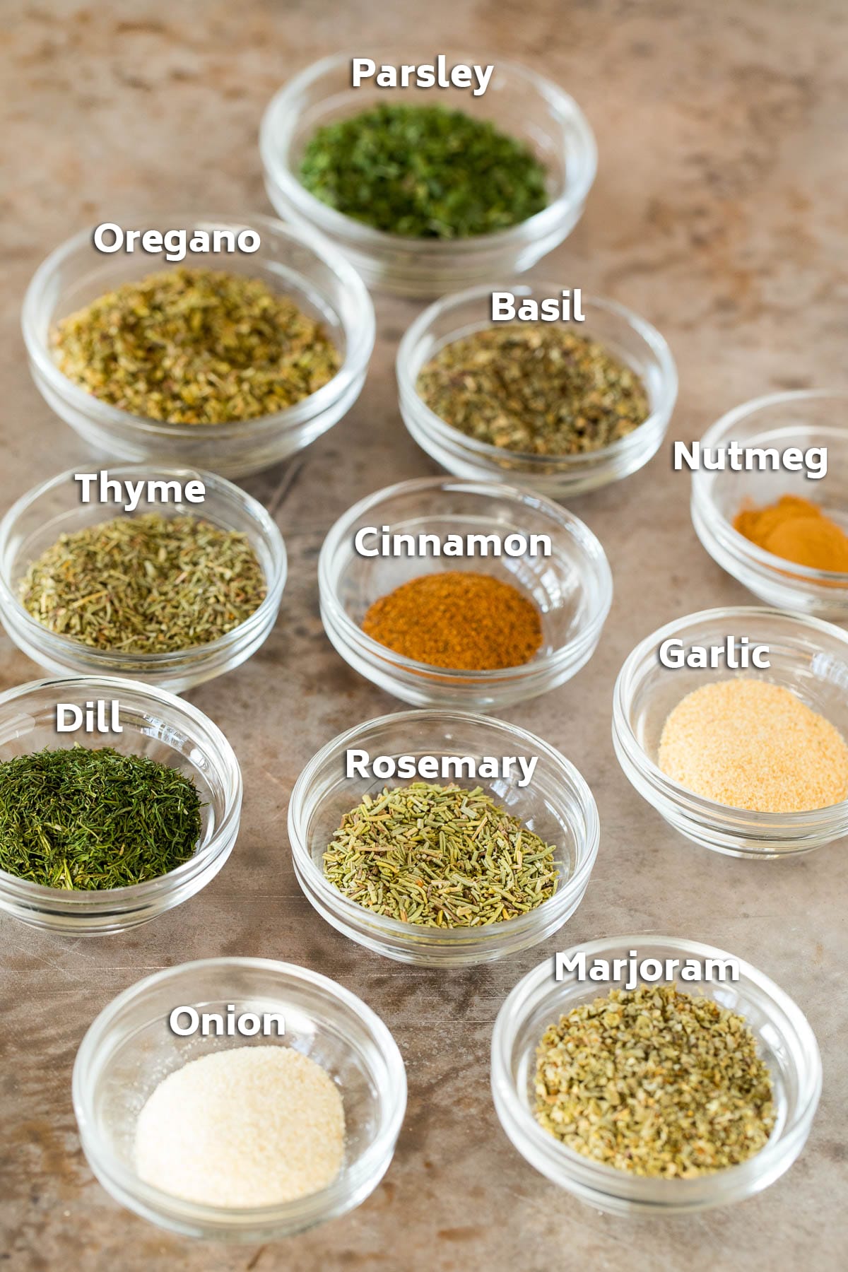 Bowls of various herbs and spices.