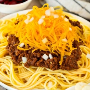 Cincinnati chili served over spaghetti with cheese and onions.