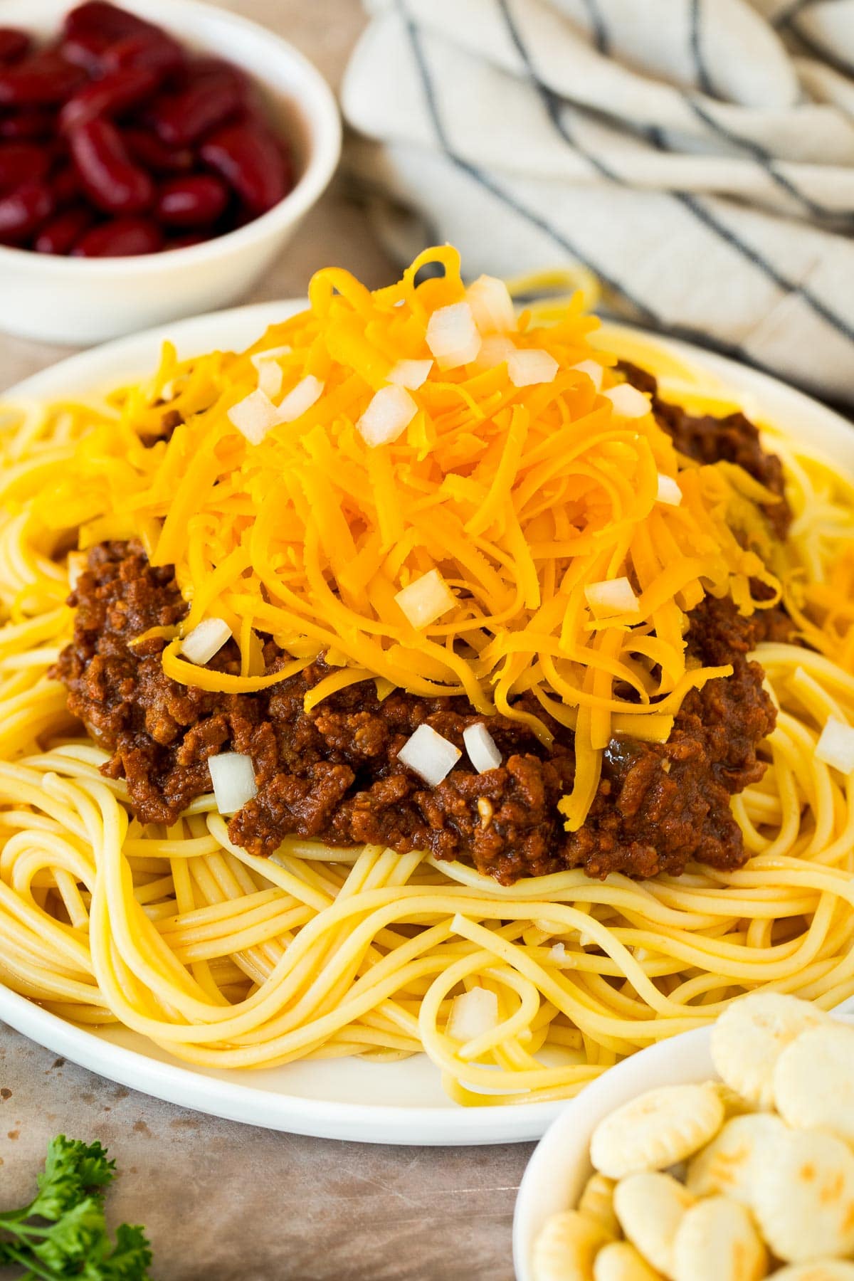 Cincinnati chili served over spaghetti with cheese and onions.