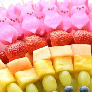 Skewers with colorful fruit and pink peeps.
