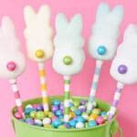 Candy pops with peeps dipped in a white coating.