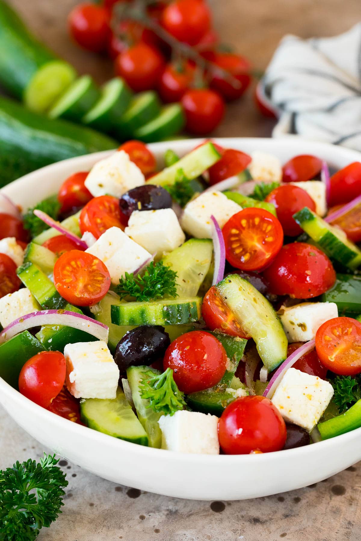 A chopped Greek salad with cucumbers, tomatoes and feta cheese.