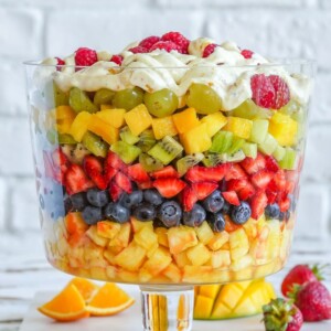 A fruit salad with seven layers of fruit like grapes, strawberries and blueberries.