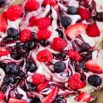 An image of berry swirl yogurt bark with berries and jam swirled into frozen yogurt.