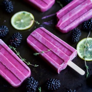 An image of three blackberry thyme popsicles.