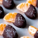 A picture of orange slices dipped half in chocolate.