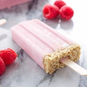 An image of a raspberry cheesecake yogurt popsicle.